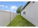 Well-maintained backyard features lush green grass and a privacy fence at 39024 Harlow Rose Dr, Zephyrhills, FL 33540