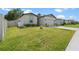 Beautifully landscaped front yard enhances the curb appeal of this home at 39024 Harlow Rose Dr, Zephyrhills, FL 33540