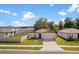 Charming single-story home features a two-car garage, well-maintained lawn, and lovely landscaping at 39024 Harlow Rose Dr, Zephyrhills, FL 33540