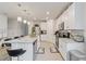 Well-lit kitchen with an island, stainless steel appliances, and plenty of counter space at 39024 Harlow Rose Dr, Zephyrhills, FL 33540