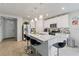 Bright kitchen with an island, stainless steel appliances, and a seamless connection to the living area at 39024 Harlow Rose Dr, Zephyrhills, FL 33540