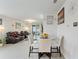 Bright open area with reclining sofas and dining space, perfect for entertaining guests at 39024 Harlow Rose Dr, Zephyrhills, FL 33540