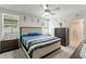 Serene main bedroom with a ceiling fan, neutral colors, and an abundance of natural light at 39024 Harlow Rose Dr, Zephyrhills, FL 33540
