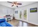 Bedroom with music keyboard, guitar, and daybed. Doors open to backyard at 4096 38Th S St, St Petersburg, FL 33711