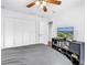 Bedroom with neutral tones, white closet doors and a ceiling fan providing a comfortable and inviting space at 4096 38Th S St, St Petersburg, FL 33711