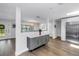 Open entryway showcasing hardwood floors, a modern console table, and stainless steel refrigerator at 4096 38Th S St, St Petersburg, FL 33711