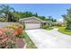 Charming home featuring manicured landscaping, a spacious driveway, and a two-car garage in a desirable neighborhood at 4096 38Th S St, St Petersburg, FL 33711