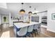 Kitchen featuring large island with seating, modern lighting and an open floor plan at 4096 38Th S St, St Petersburg, FL 33711