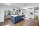 Spacious kitchen with a large island, modern lighting, and open access to the living room at 4096 38Th S St, St Petersburg, FL 33711