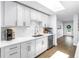 Bright kitchen with white cabinets, stainless steel appliances, and hardwood floors at 4096 38Th S St, St Petersburg, FL 33711