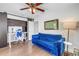 Office featuring hardwood floors, a dark built-in bookcase, and a comfortable blue couch at 4096 38Th S St, St Petersburg, FL 33711