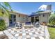 Inviting outdoor patio features comfortable seating around a modern fire pit, perfect for relaxing at 4096 38Th S St, St Petersburg, FL 33711