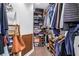 Well-organized walk-in closet with shelving, rods, and storage for clothing, shoes, and accessories at 4096 38Th S St, St Petersburg, FL 33711