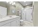 Well-lit bathroom features a modern shower, vanity, and tiled floors at 4103 Via Piedra Cir # 10-101, Sarasota, FL 34233