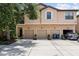 Charming townhome with three garage doors and a well-maintained concrete driveway at 4103 Via Piedra Cir # 10-101, Sarasota, FL 34233