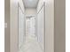 Neutral hallway showcases three doors and clean, tiled floors at 4103 Via Piedra Cir # 10-101, Sarasota, FL 34233