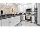 Bright kitchen boasts stainless steel appliances, white cabinets, and an open layout at 4103 Via Piedra Cir # 10-101, Sarasota, FL 34233