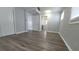 Secondary bedroom with luxury vinyl plank flooring, fresh paint, and closet storage at 4470 Mainlands W Blvd, Pinellas Park, FL 33782
