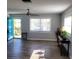 Inviting living room featuring luxury vinyl plank flooring and lots of natural light at 4470 Mainlands W Blvd, Pinellas Park, FL 33782