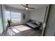 Sunroom features large windows, a ceiling fan, and light-colored walls and floors at 4470 Mainlands W Blvd, Pinellas Park, FL 33782