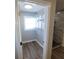 Walk-in closet with window and plenty of room for storage and new wire shelving at 4470 Mainlands W Blvd, Pinellas Park, FL 33782