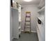 This is a walk-in closet with white shelves and gray walls, offering ample storage space at 4470 Mainlands W Blvd, Pinellas Park, FL 33782