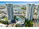 Stunning aerial view of the Towers condominium complex featuring a pool, manicured landscaping, and waterfront views at 449 S 12Th St # 1004, Tampa, FL 33602