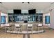 This modern bar area features stylish seating, a sleek countertop, and views of the outdoor gazebo at 449 S 12Th St # 1004, Tampa, FL 33602