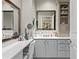 This bathroom features double mirrors, a makeup station and cabinet for easy storage at 449 S 12Th St # 1004, Tampa, FL 33602