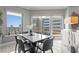 Inviting dining area with a modern table, comfortable seating, and bright windows offering cityscape views at 449 S 12Th St # 1004, Tampa, FL 33602