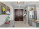 Elegant foyer featuring tile floors, recessed lighting, and a decorative plant, leading to the rest of the home at 449 S 12Th St # 1004, Tampa, FL 33602