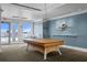 Well-lit game room featuring a billiard table, modern artwork, and outdoor access at 449 S 12Th St # 1004, Tampa, FL 33602