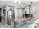 Open-concept kitchen with stainless steel appliances, granite counters, and a breakfast bar with seating at 449 S 12Th St # 1004, Tampa, FL 33602
