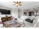 Bright living room featuring a modern white leather sofa, ceiling fan, and elegant decor throughout at 449 S 12Th St # 1004, Tampa, FL 33602
