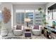 Bright living room with city views, two armchairs, and stylish decor at 449 S 12Th St # 1004, Tampa, FL 33602
