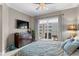 Serene main bedroom featuring balcony access, a ceiling fan, and elegant furnishings at 449 S 12Th St # 1004, Tampa, FL 33602