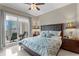 Comfortable main bedroom with a private balcony, plush bedding, and stylish decor at 449 S 12Th St # 1004, Tampa, FL 33602