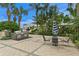 Outdoor kitchen area featuring modern stainless steel grills and a comfortable seating area with striped umbrella at 449 S 12Th St # 1004, Tampa, FL 33602