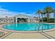 Large pool area with a bar, lounge chairs, and tables, offering a perfect blend of relaxation and entertainment at 449 S 12Th St # 1004, Tampa, FL 33602