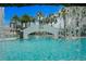 Experience the tropical paradise by the pool, featuring palm trees, a unique bridge, and waterfall features at 449 S 12Th St # 1004, Tampa, FL 33602