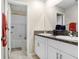 Bright bathroom with double vanity, granite counters, and separate tub and shower at 4918 Wild Senna Blvd, Tampa, FL 33619