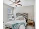 Comfortable bedroom featuring soft lighting, a plush bed, and a serene atmosphere for relaxation at 4918 Wild Senna Blvd, Tampa, FL 33619