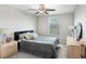 Bedroom featuring plush carpet, ceiling fan, neutral walls, window and dresser storage at 4918 Wild Senna Blvd, Tampa, FL 33619