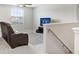 Upstairs bonus room or loft with a comfortable seating area, ideal for a relaxation space or entertainment at 4918 Wild Senna Blvd, Tampa, FL 33619