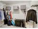 Large walk-in closet with ample storage, wire shelving and closet rods for organization at 4918 Wild Senna Blvd, Tampa, FL 33619