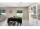 Cozy dining room with natural light, providing a comfortable space for Gathering meals and gatherings at 4918 Wild Senna Blvd, Tampa, FL 33619