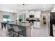 Spacious kitchen with stainless steel appliances, an island, and a walk-in pantry, perfect for storage and meal prep at 4918 Wild Senna Blvd, Tampa, FL 33619