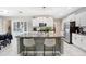Beautiful kitchen featuring granite countertops, stainless steel appliances, and a center island with bar seating at 4918 Wild Senna Blvd, Tampa, FL 33619