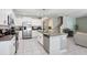 Bright and airy kitchen boasting stainless appliances, granite counters and a large center island at 4918 Wild Senna Blvd, Tampa, FL 33619