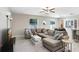 Open-concept living space with a comfortable sectional sofa and modern decor at 4918 Wild Senna Blvd, Tampa, FL 33619